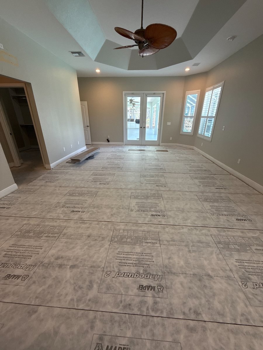 Living room before: bare subfloor